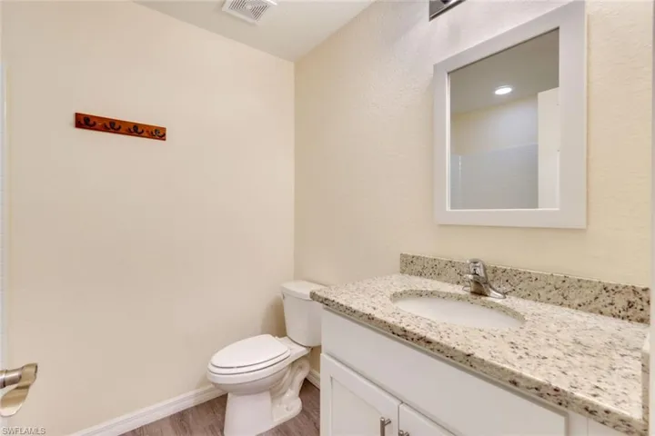 Bathroom with vanity and light wood-type flooring