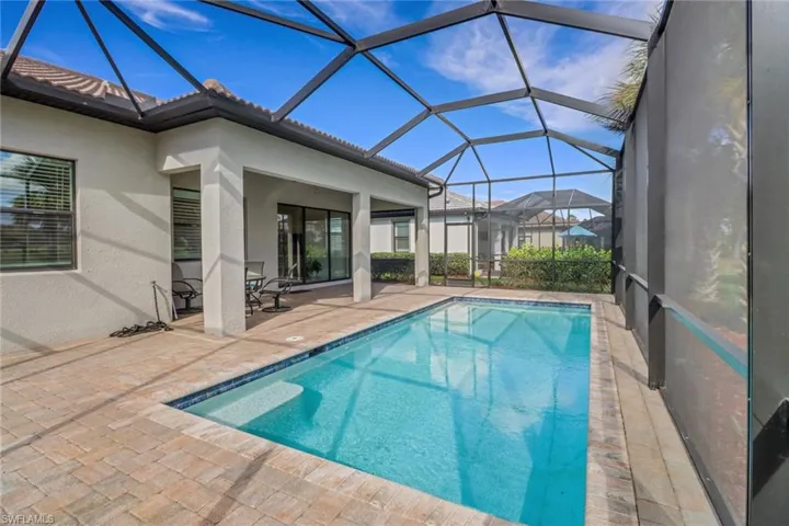 Swimming pool with a patio area and a lanai