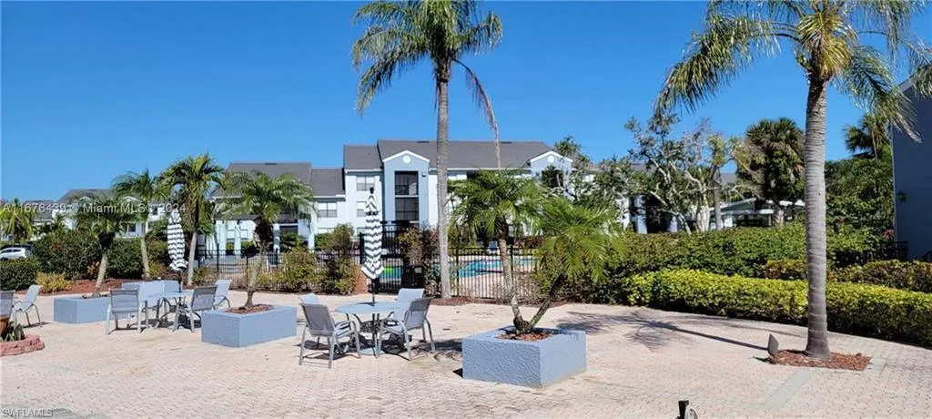Surrounding community featuring a pool and a patio area