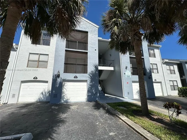 View of building exterior with a garage