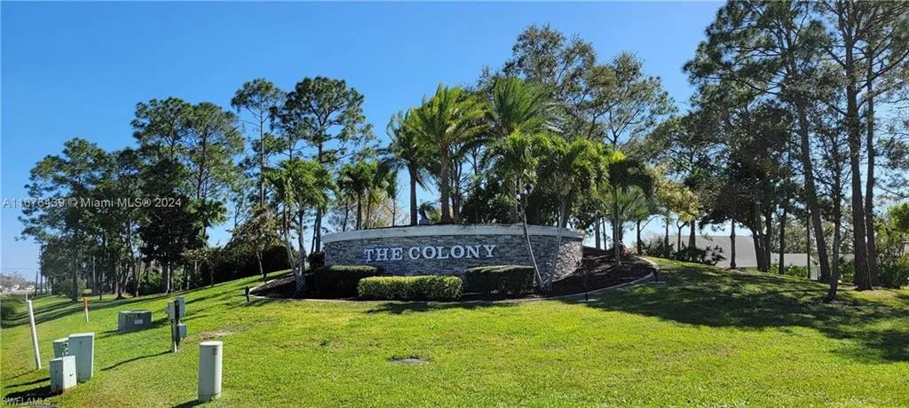 Community / neighborhood sign with a lawn