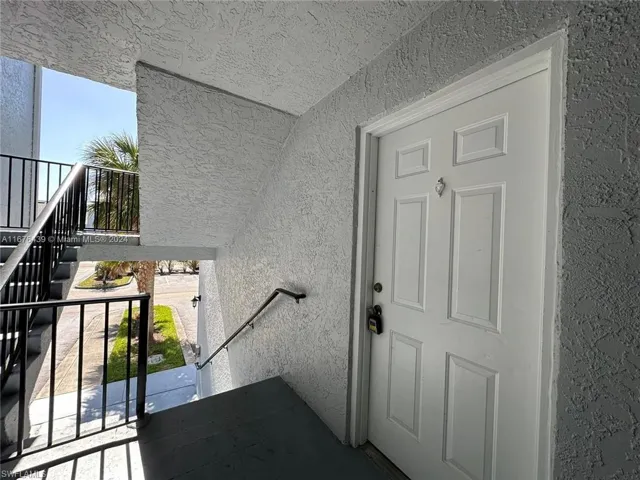 View of exterior entry featuring a balcony