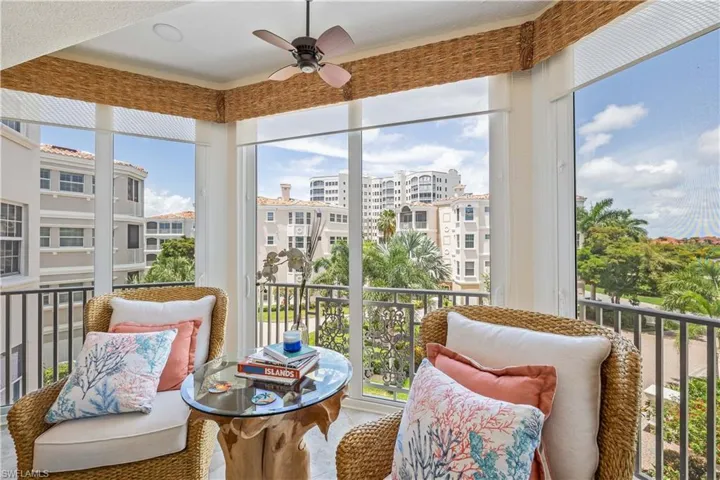 Sunroom with a healthy amount of sunlight and ceiling fan