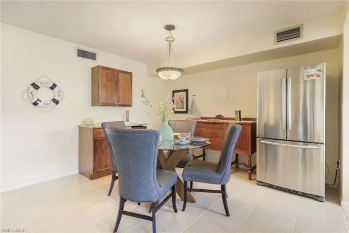 Dining area featuring light tile patterned flooring