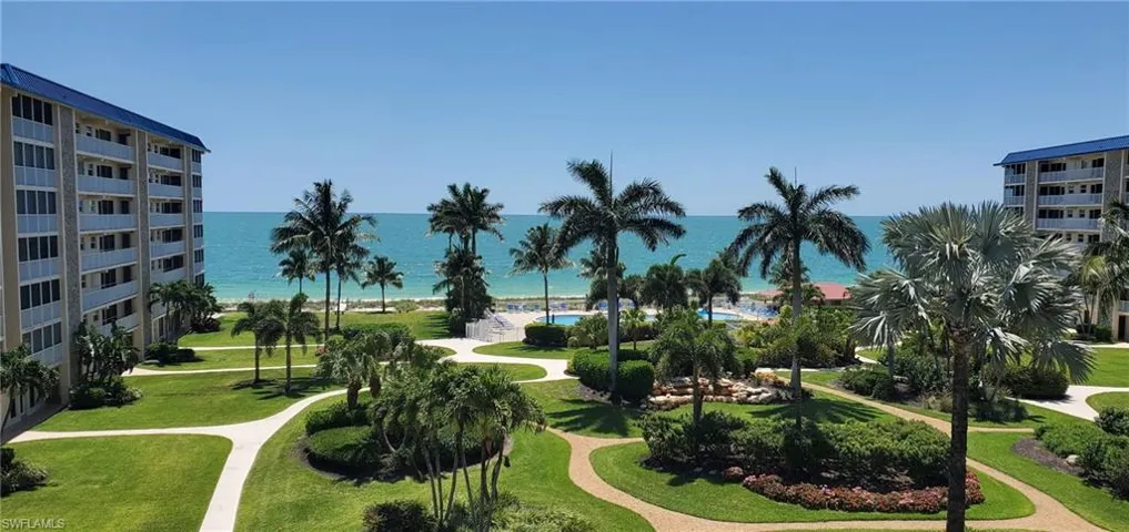 View of community with a water view and a lawn