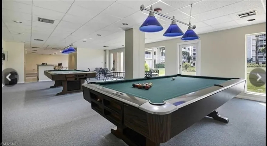 Rec room with pool table, carpet, and a drop ceiling