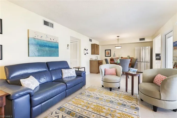 Living room with light tile patterned flooring