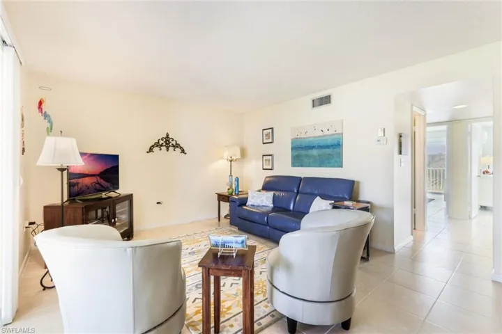 Living room featuring light tile patterned floors