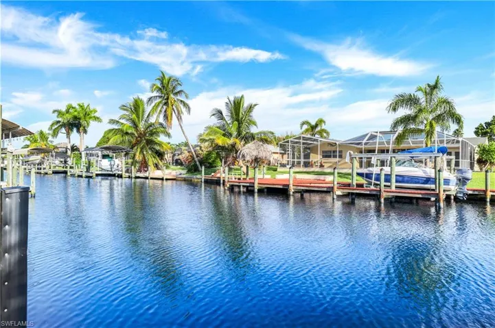 Dock with boat lift and a water view
