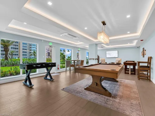 Recreation room with billiards and recessed lighting