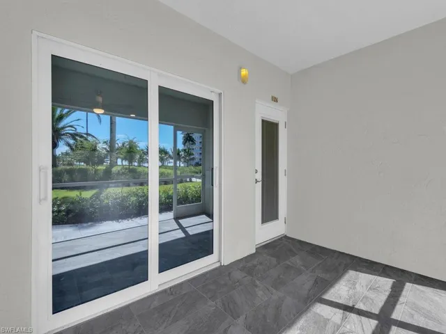 Empty room with dark stone finish flooring