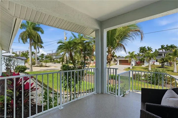 Covered porch featuring a residential view - Virtually Edited Image