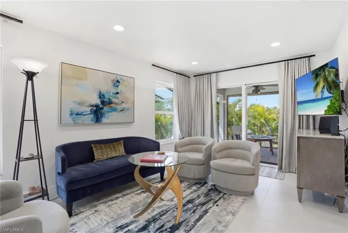 Living area featuring recessed lighting and a ceiling fan - Virtually Edited Image