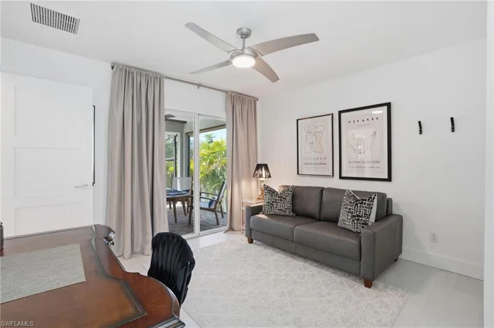 Office area with ceiling fan and baseboards - Virtually Edited Image