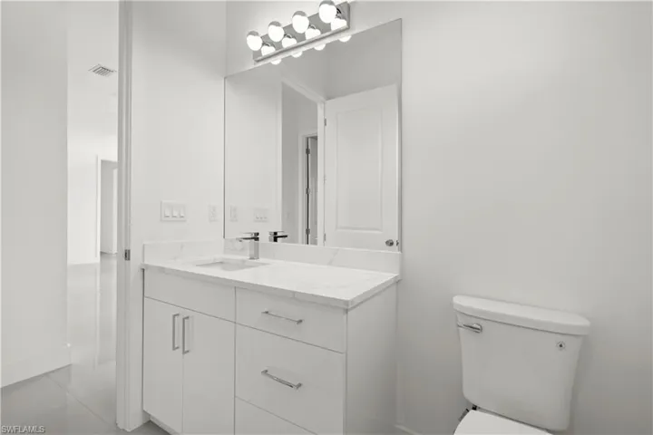 Bathroom featuring vanity and light tile patterned floors