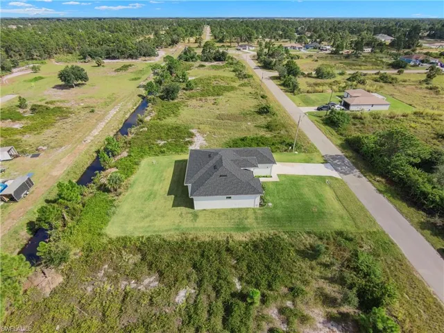 Aerial view of property and surrounding area with rural landscape