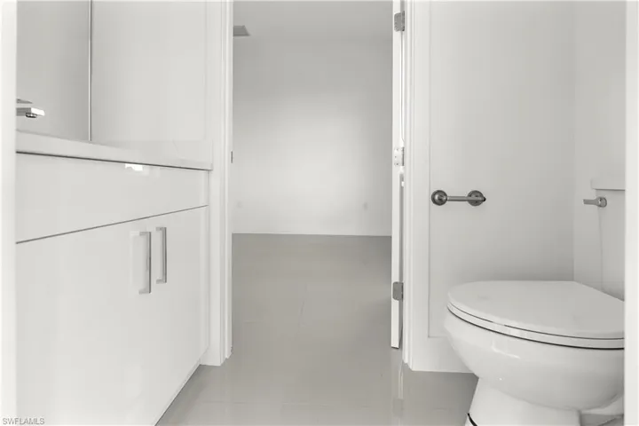 Bathroom featuring toilet and baseboards