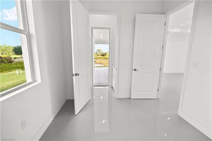 Corridor featuring baseboards