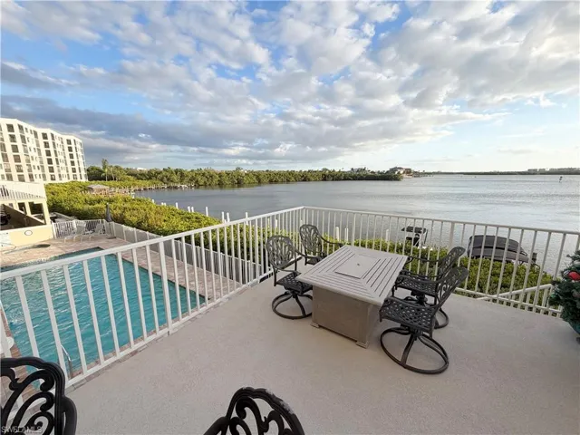 View of patio with a water view