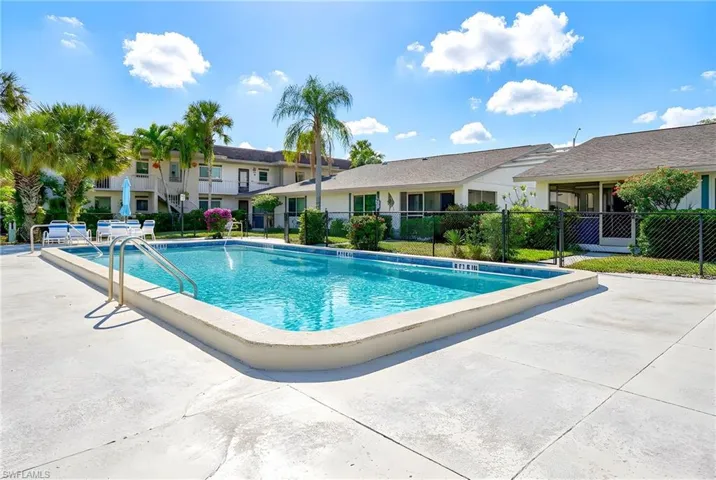 Community pool with a patio area