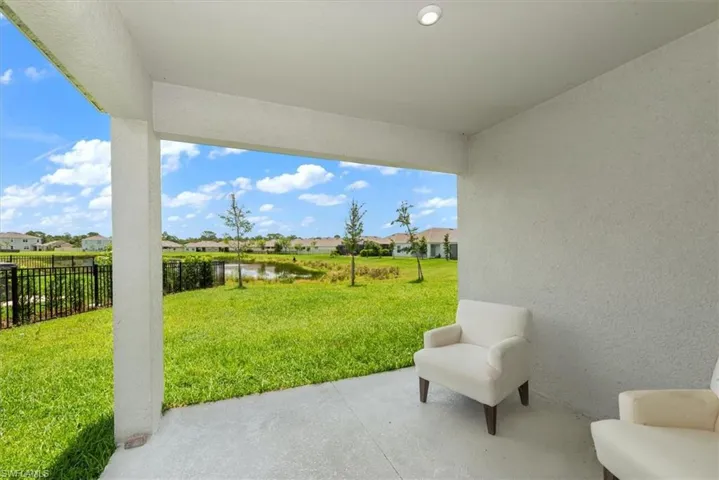 View of patio / terrace with a water view and a residential view