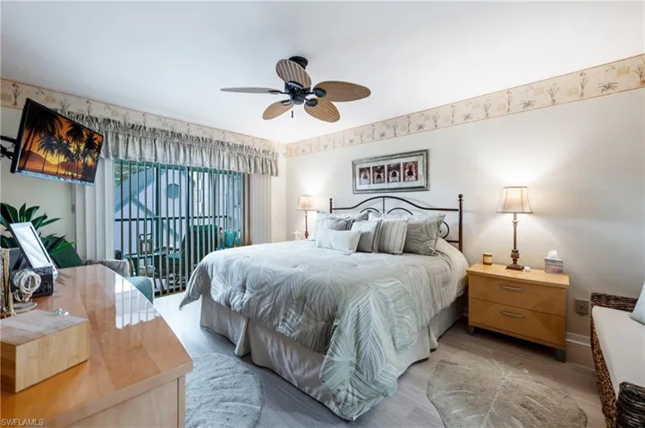 Bedroom featuring ceiling fan and light hardwood / wood-style floors