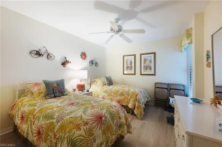 Bedroom featuring light hardwood / wood-style floors and ceiling fan