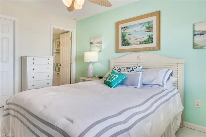 Bedroom with connected bathroom and ceiling fan
