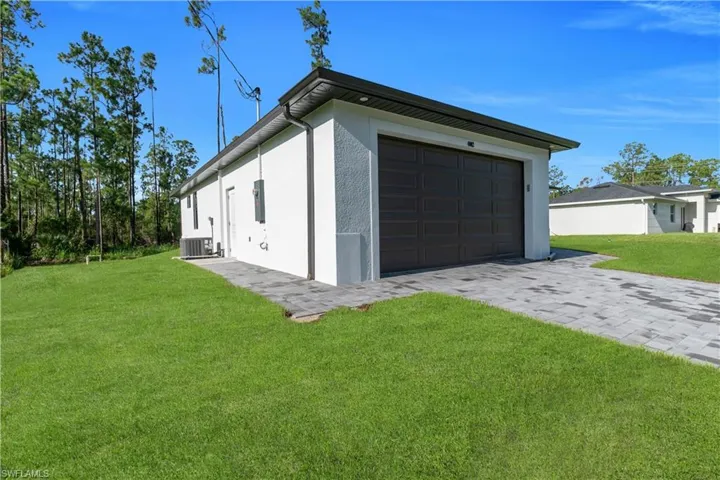 Garage with decorative driveway