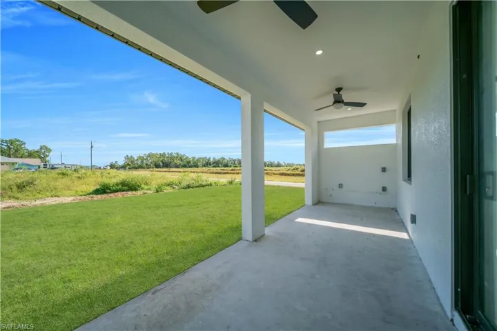 View of patio with a ceiling fan