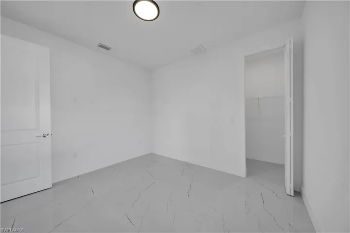 Empty room with light marble finish floors
