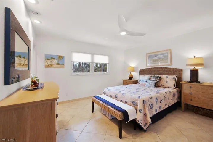 Tiled bedroom with ceiling fan