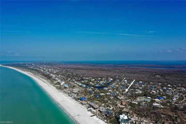 Bird's eye view featuring a view of the beach and a water view