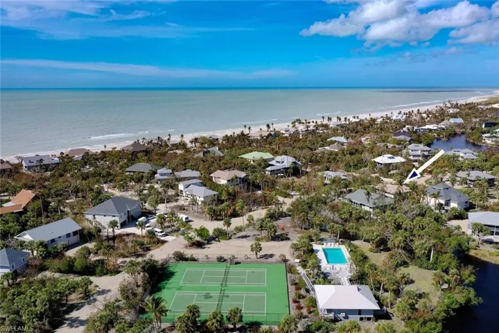 Drone / aerial view featuring a water view and a beach view