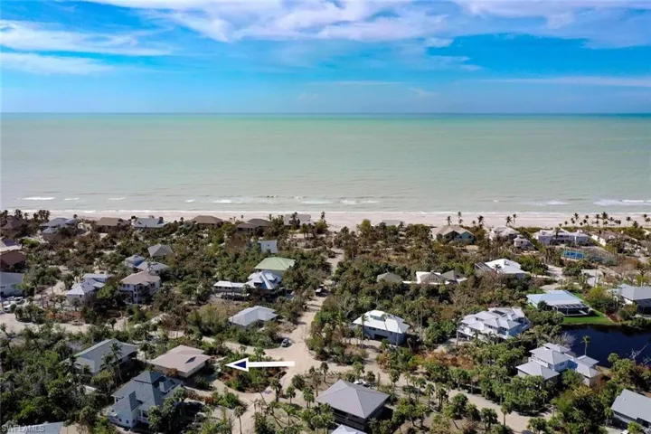 Bird's eye view with a beach view and a water view