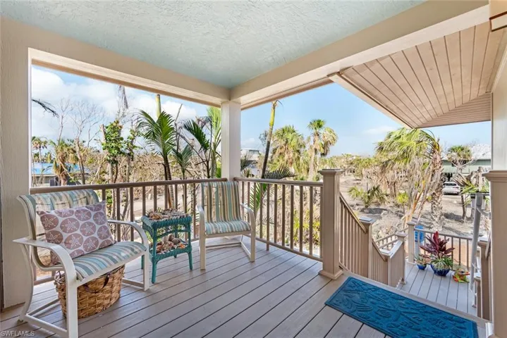 Sunroom featuring plenty of natural light and vaulted ceiling