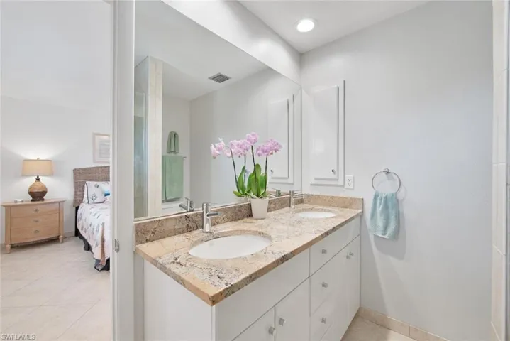 Bathroom featuring vanity and tile patterned floors