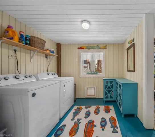Laundry room with washing machine and clothes dryer