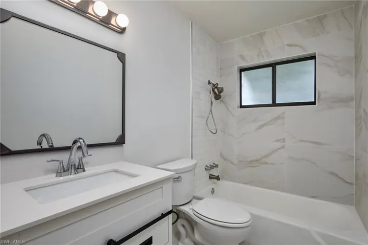 Bathroom with vanity and shower / bathtub combination