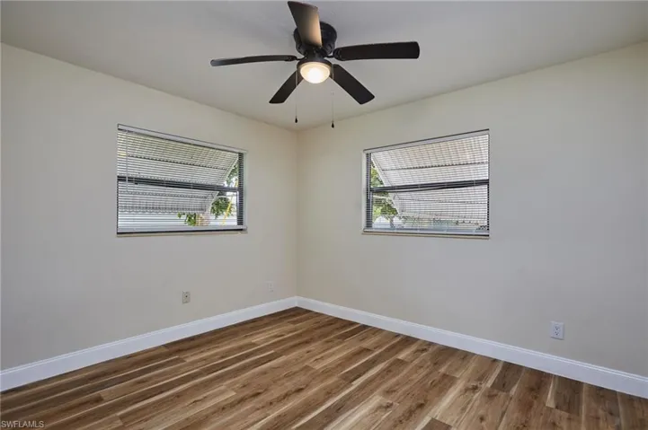 Room featuring wood like finished floors and a ceiling fan