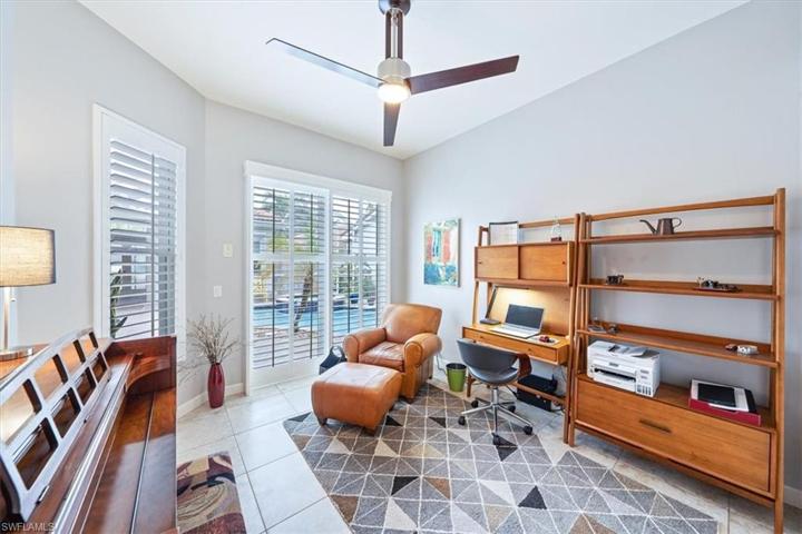 Bedroom currently used as an office has sliding doors to pool