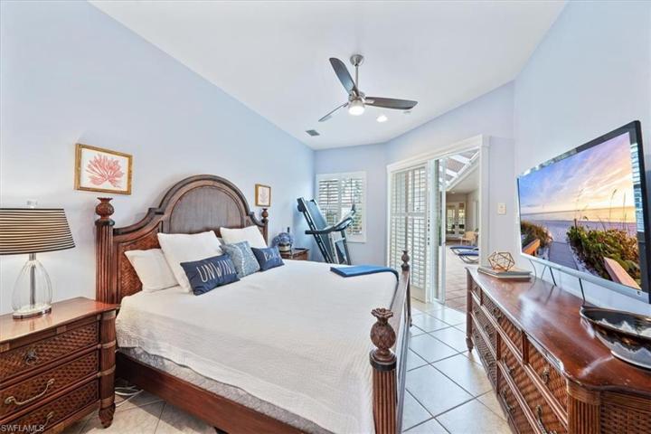 Cabana Bedroom has sliding doors to the pool/courtyard