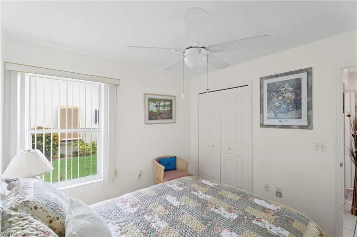 Bedroom featuring multiple windows, a closet, and ceiling fan