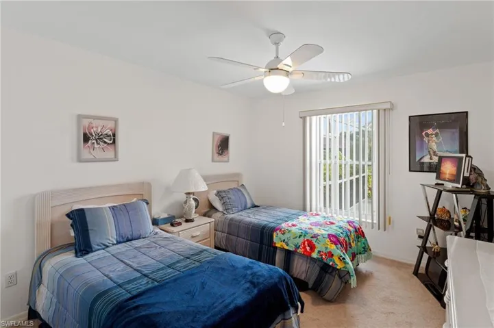 Bedroom with carpet flooring and a ceiling fan