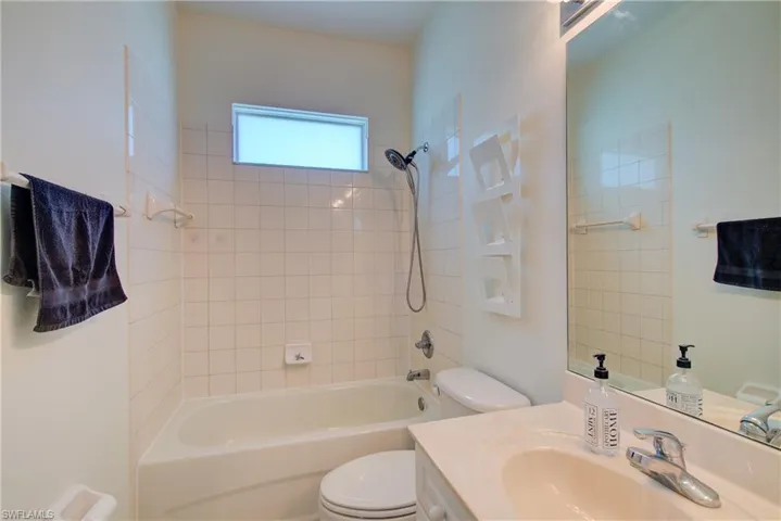 Bathroom with bathtub / shower combination and vanity