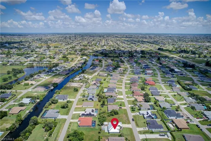 View of property location featuring nearby suburban area and a large body of water