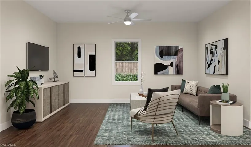 Living area featuring dark wood-type flooring and ceiling fan Picture is an artists rendering.