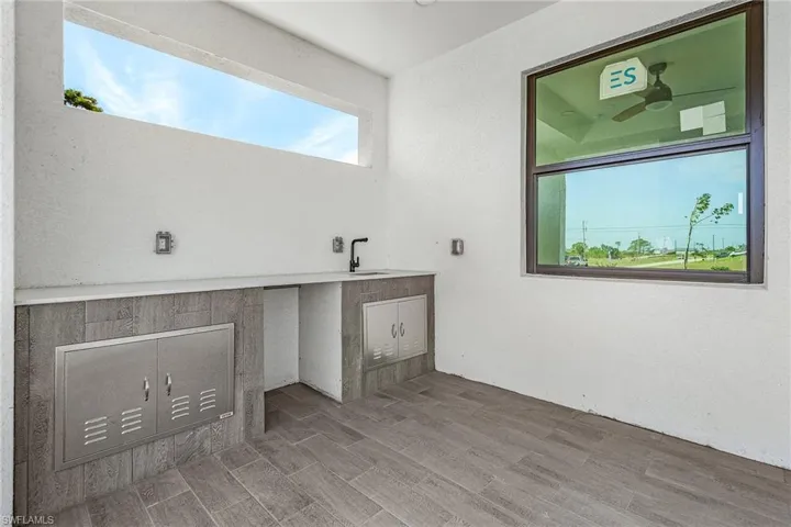 Bathroom with a sink and wood finished floors