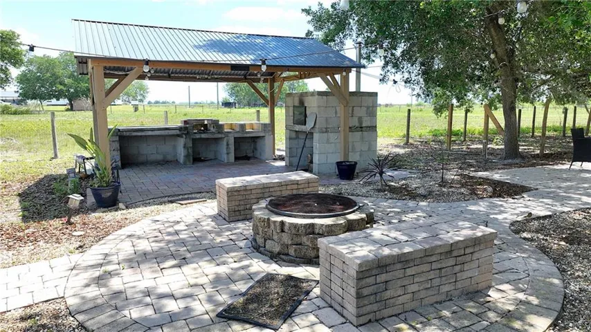 Brick all and fire pit