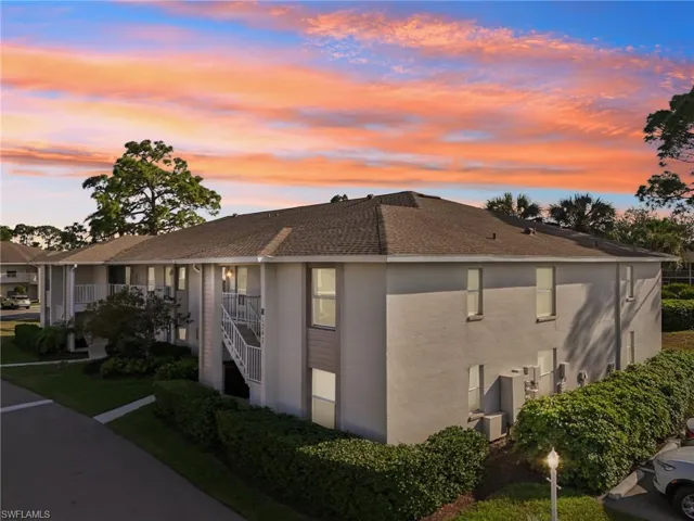 View of property exterior at dusk